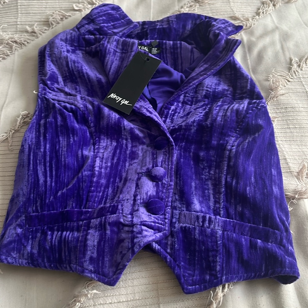 Bright purple textured velvet vest. Matching shorts in my closet!
